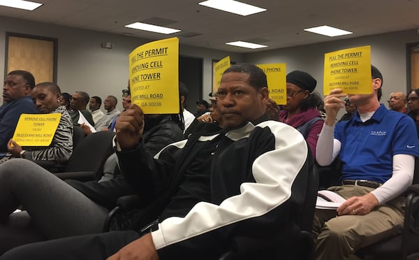 Stonecrest residents advocate for the removal of a cell tower at Monday night's City Council meeting. (Photo: J.D. CAPELOUTO / jdcapelouto@ajc.com)