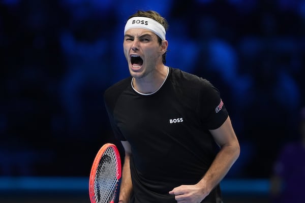 United States' Taylor Fritz reacts after winning a point against Australia's Alex de Minaur during their singles tennis match of the ATP World Tour Finals at the Inalpi Arena, in Turin, Italy, Thursday, Nov. 14, 2024. (AP Photo/Antonio Calanni)