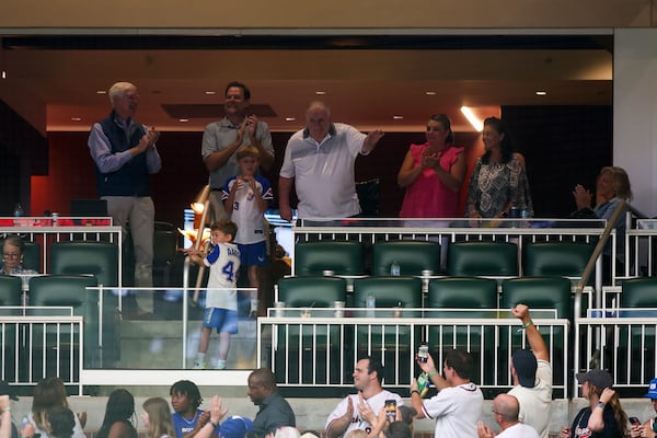 Former Atlanta Braves manager Bobby Cox, center top, waves to the crowd during a baseball game against the Philadelphia Phillies, Saturday, July 6, 2024, in Atlanta. (AP Photo/Brett Davis)