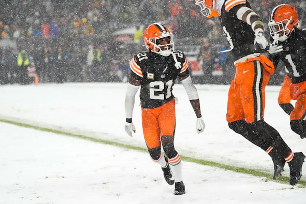 Cleveland Browns cornerback Denzel Ward (21) celebrates after breaking up a pass to end the game in the second half of an NFL football game against the Pittsburgh Steelers, Thursday, Nov. 21, 2024, in Cleveland. The Browns won 24-19. (AP Photo/Sue Ogrocki)