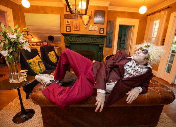 Ash Parker is ready for Halloween with his Beetlejuice costumes at his home on Wednesday, Oct 9, 2024.  (Jenni Girtman for The Atlanta Journal-Constitution)