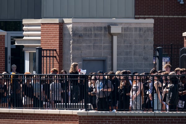 Students at Decatur High School stage a short walkout against gun violence on Friday, Sept. 20, 2024. (Ben Gray for the AJC)