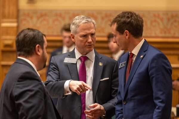 State Sens. Jason Anavitarte, R-Dallas; John F. Kennedy, R-Macon; and Greg Dolezal, R-Cumming, confer in the Senate at the Capitol in Atlanta on Thursday. Kennedy was the primary author of a bill to rewrite Georgia’s litigation rules.