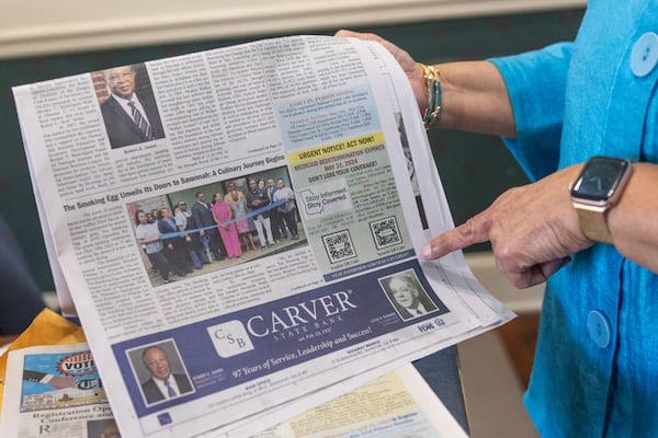 Shirley James points at a urgent notice in the Savannah Tribune newspaper on May 29, 2024, in Savannah. Katelyn Myrick/AJC 2024