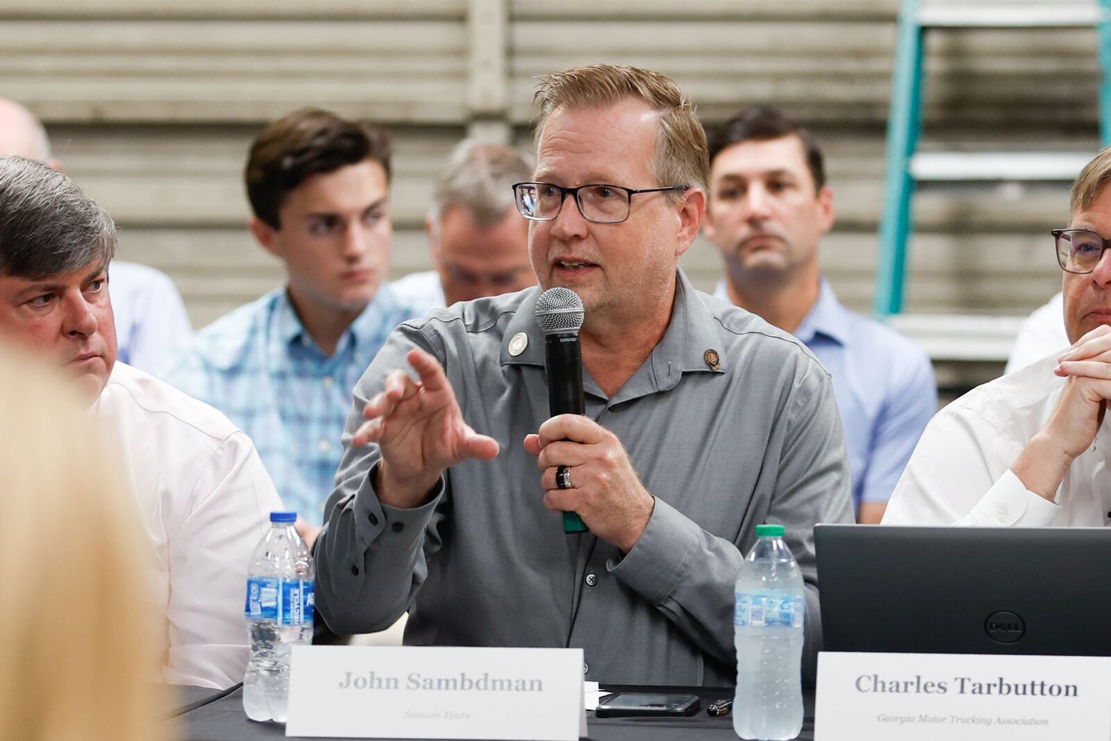 Samson Tours CEO John Sambdman speaks to state lawmakers and other small business leaders during a roundtable discussion on civil litigation policies impacting the state's business climate at Samson Tours headquarters in Atlanta on Thursday, Aug. 22, 2024. (Natrice Miller/ AJC)