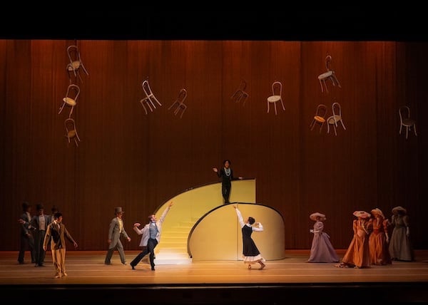 Brooke Gilliam as Shadow-Chanel, top, Mikaela Santos as Coco, bottom center, and Marius Morawski as Balsan, left (at the foot of the stairs).