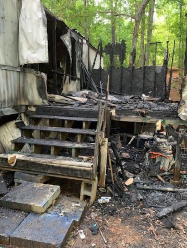 Officals are investigating after someone burned down a mobile home Saturday afternoon in Dawsonville. 