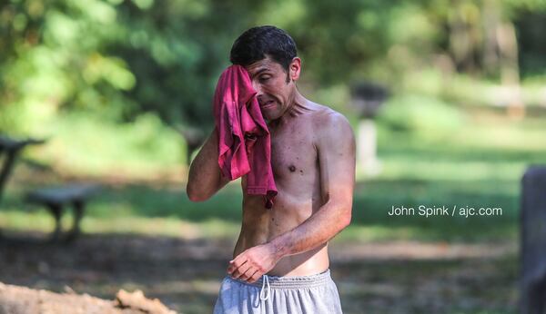 Doug Kinsman was drenched in sweat after a 7-mile run at Cochran Shoals  in Cobb County.