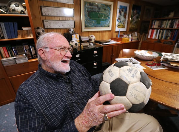 The autographs are a  little faded now on the 1968 Atlanta Chiefs soccer ball prized by the team's vice president at the time, Dick Cecil. (Curtis Compton/ccompton@ajc.com)