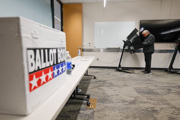 A voter casts a ballot during early voting in Waukesha, Wis., Tuesday, March 18, 2025. (AP Photo/Jeffrey Phelps)