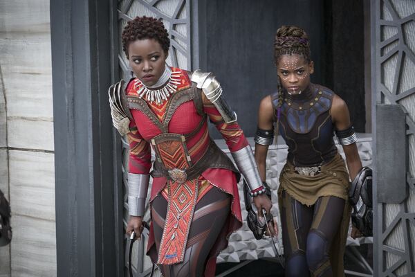 Lupita Nyong’o, left, and Letitia Wright in a scene from Marvel Studios’ “Black Panther.” The movie is breaking records with box office receipts. Matt Kennedy/Marvel Studios-Disney