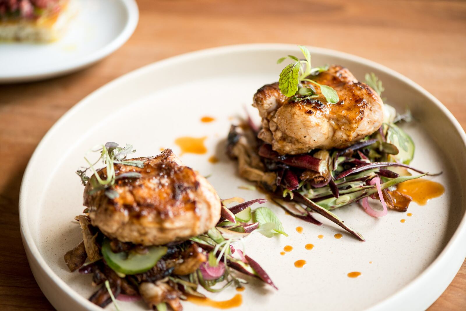 Miso Rabbit Loin with long beans, oyster mushrooms, charred cucumber, and jus. Photo credit- Mia Yakel.