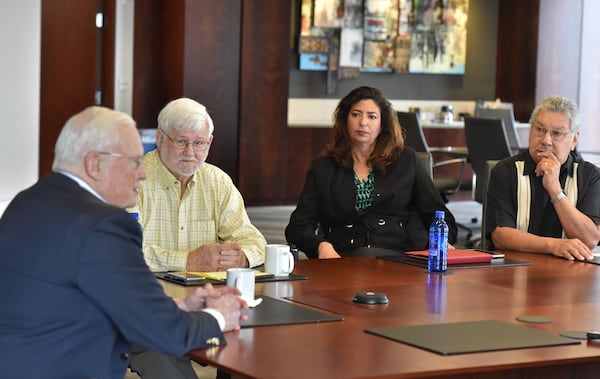 Atlanta lawyer Emmet Bondurant, left, and members of the California Citizens Redistricting Commission — from left, Stan Forbes, Jodie Filkins Webber and Gabino Aguirre — discuss the subject of redistricting Thursday at Bondurant Mixson & Elmore LLP. Bondurant represents the plaintiffs in a North Carolina lawsuit involving redistricting that appears headed to the U.S. Supreme Court. HYOSUB SHIN / HSHIN@AJC.COM