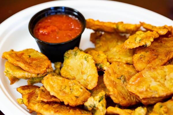 Bhajias are next-level french fries. A gram flour coating seasoned with cilantro and salt makes them extra crispy when fried. Ryan Fleisher for The Atlanta Journal-Constitution