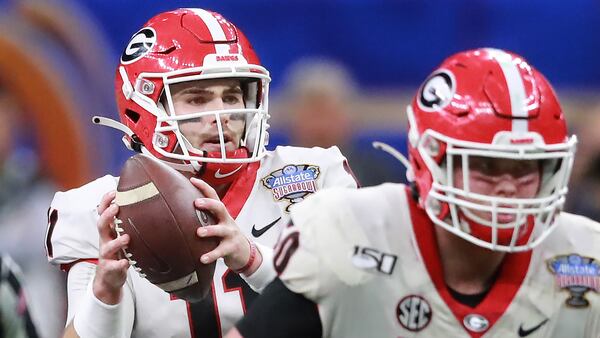 Jake Fromm looks to pass while Warren Ericson blocks against Baylor in the Sugar Bowl at the Mercedes-Benz Superdome on Wednesday, Jan. 1, 2020, in New Orleans.