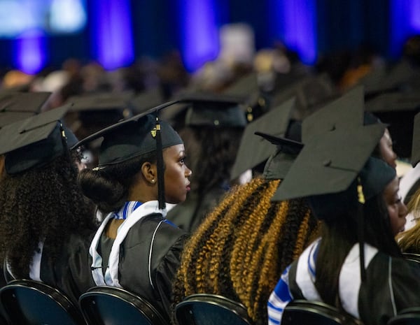 Olivia Mwangi, a psychology major, listens to Angela Bassett’s commencement speech at Spelman College’s 137th commencement at the Georgia International Convention Center on Sunday, May 19, 2024. Angela Bassett, the keynote speaker, and Supreme Court Justice Ketanji Brown Jackson were both awarded honorary degrees.  (Jenni Girtman for The Atlanta Journal-Constitution)