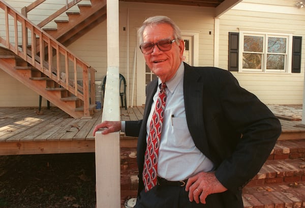 Former Roswell Mayor Pug Mabry in Roswell. In this file photo, he's restoring the 1916 house in background. (Louie Favorite/The Atlanta Journal-Constitution)