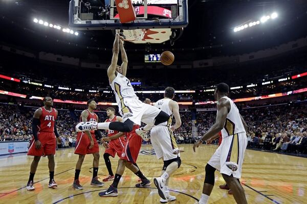 New Orleans Pelicans forward Anthony Davis (23) slam dunks in the second half of an NBA basketball game against the Atlanta Hawks in New Orleans, Monday, Feb. 2, 2015. The Pelicans won 115-100. (AP Photo/Gerald Herbert) The splendid Anthony Davis slams the door on the Hawks. (Gerald Herber/AP photo)