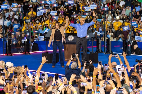 Democratic presidential candidate Kamala Harris and former president Barack Obama celebrate at the end of Harris’ campaign rally Thursday in Clarkston, in DeKalb County. (Arvin Temkar / AJC)