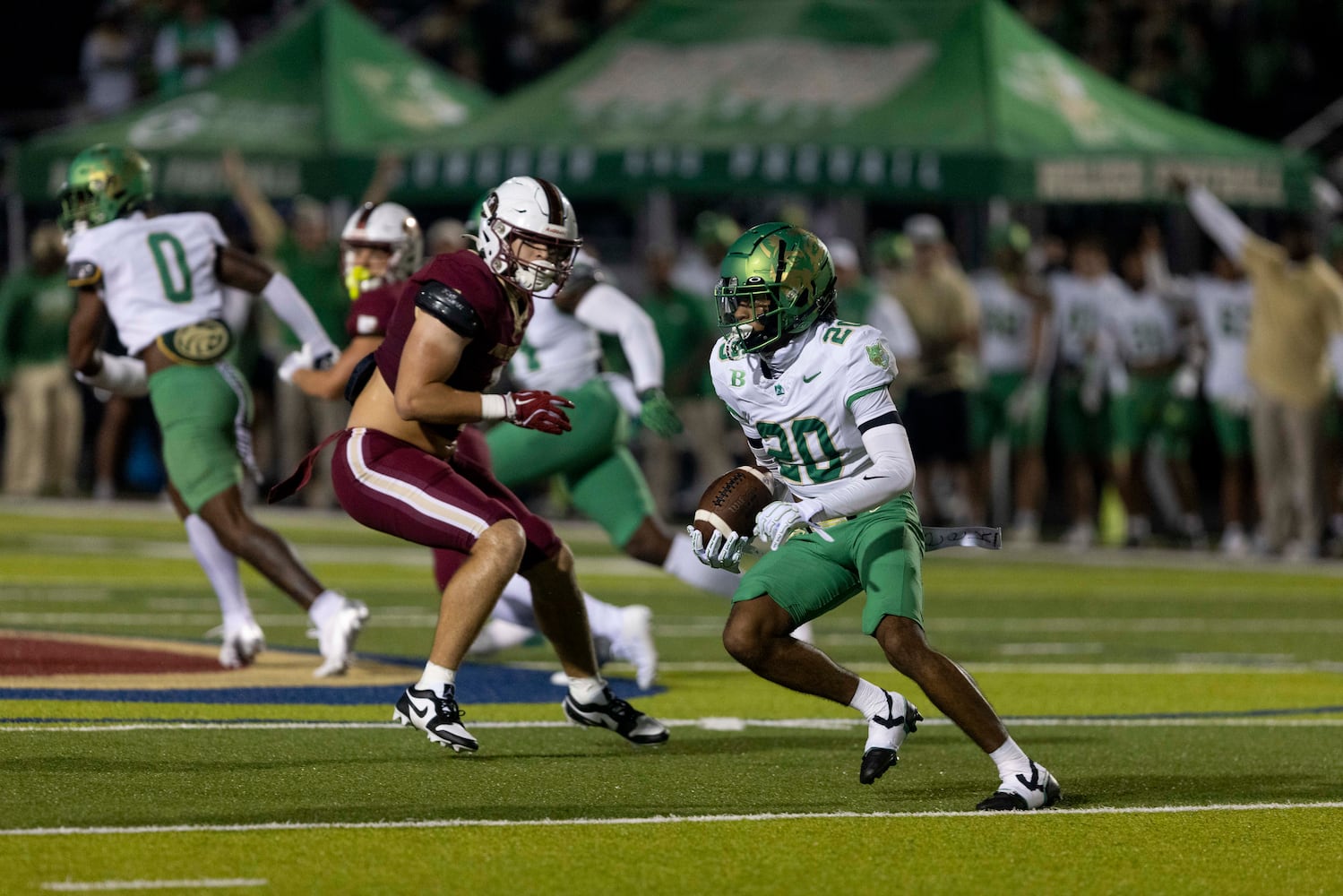 Buford’s Demarious Nibbe (20) returns an interception. (Photo/Jenn Finch, AJC)