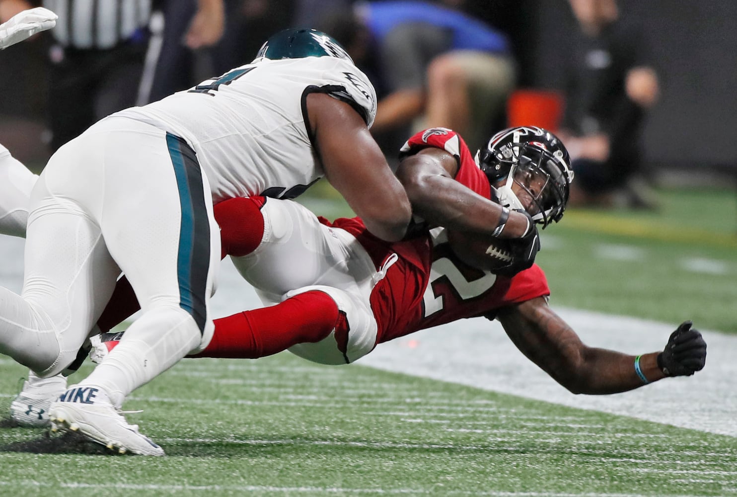 Photos: Falcons outlast Eagles for first win