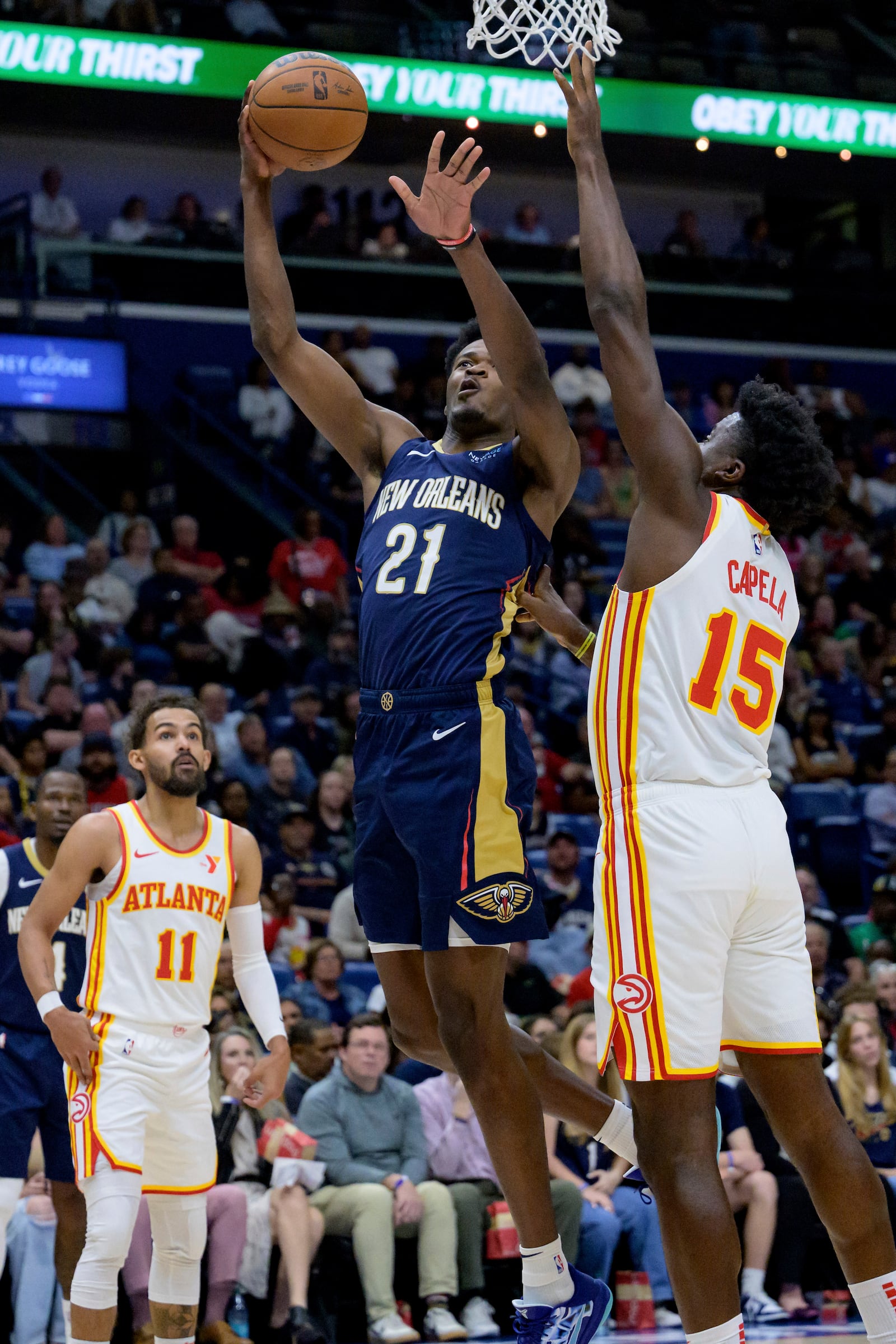 New Orleans Pelicans center Yves Missi (21) shoots against Atlanta Hawks center Clint Capela (15) during the first half of an NBA basketball game in New Orleans, Sunday, Nov. 3, 2024. (AP Photo/Matthew Hinton)