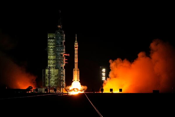 A Long March rocket with a Shenzhou-19 spacecraft atop takes off from the Jiuquan Satellite Launch Center in Jiuquan, northwestern China in the early hours of Wednesday, Oct. 30, 2024. (AP Photo/Ng Han Guan)