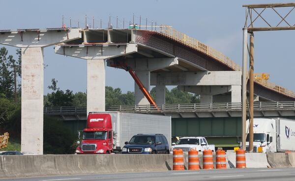 Construction is ongoing for the Northwest Corridor express lane project, which will add 29.7 miles of reversible toll lanes in the I-75/I-575 corridor. BOB ANDRES/BANDRES@AJC.COM