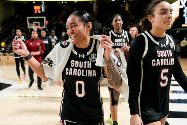 South Carolina's Te-Hina Paopao (0) and Tessa Johnson (5) walk off the court after the team's win in an NCAA college basketball game against Vanderbilt, Sunday, Feb. 23, 2025, in Nashville, Tenn. (AP Photo/George Walker IV)