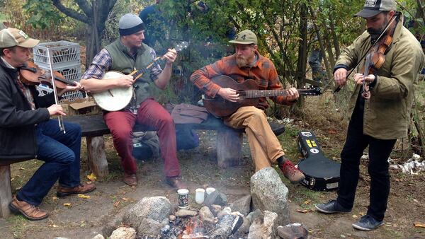 In an orchard at Fruit City Farms on Lopez Island, musicians entertain around a bonfire during an Octoer 2017 farm tour.  (Brian J. Cantwell /Seattle Times/TNS)