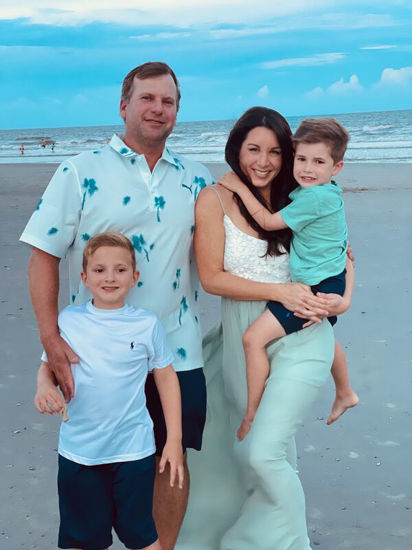 Gene and Ashley Siller with their sons Beau and Banks on vacation at Folly Beach, South Carolina, two days before Gene was killed at Pinetree Country Club. Courtesy of Ashley Siller