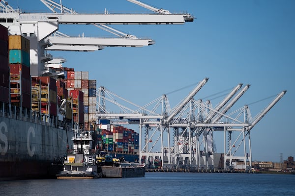 A tug boat handles a fueling barge next to the MSC Vigo container ship docked at the Garden City Port Terminal on Nov. 12, 2021, in Garden City, Georgia. (Sean Rayford/Getty Images/TNS)