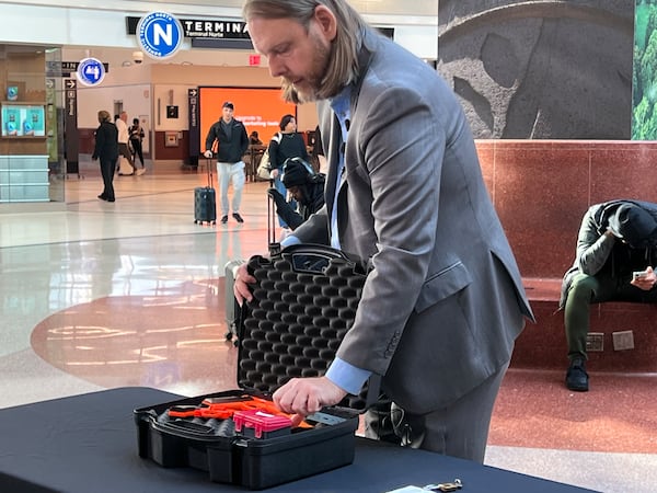 Transportation Security Administration spokesman Mark Howell at Hartsfield-Jackson International Airport on January 16, 2025 demonstrated the proper way to pack a firearm in checked luggage for travel.