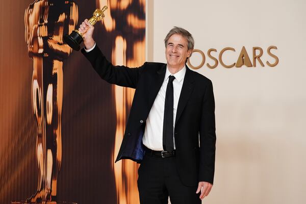 Walter Salles, winner of the award for "I'm Still Here" from Brazil, for best international feature film, poses in the press room at the Oscars on Sunday, March 2, 2025, at the Dolby Theatre in Los Angeles. (Photo by Jordan Strauss/Invision/AP)