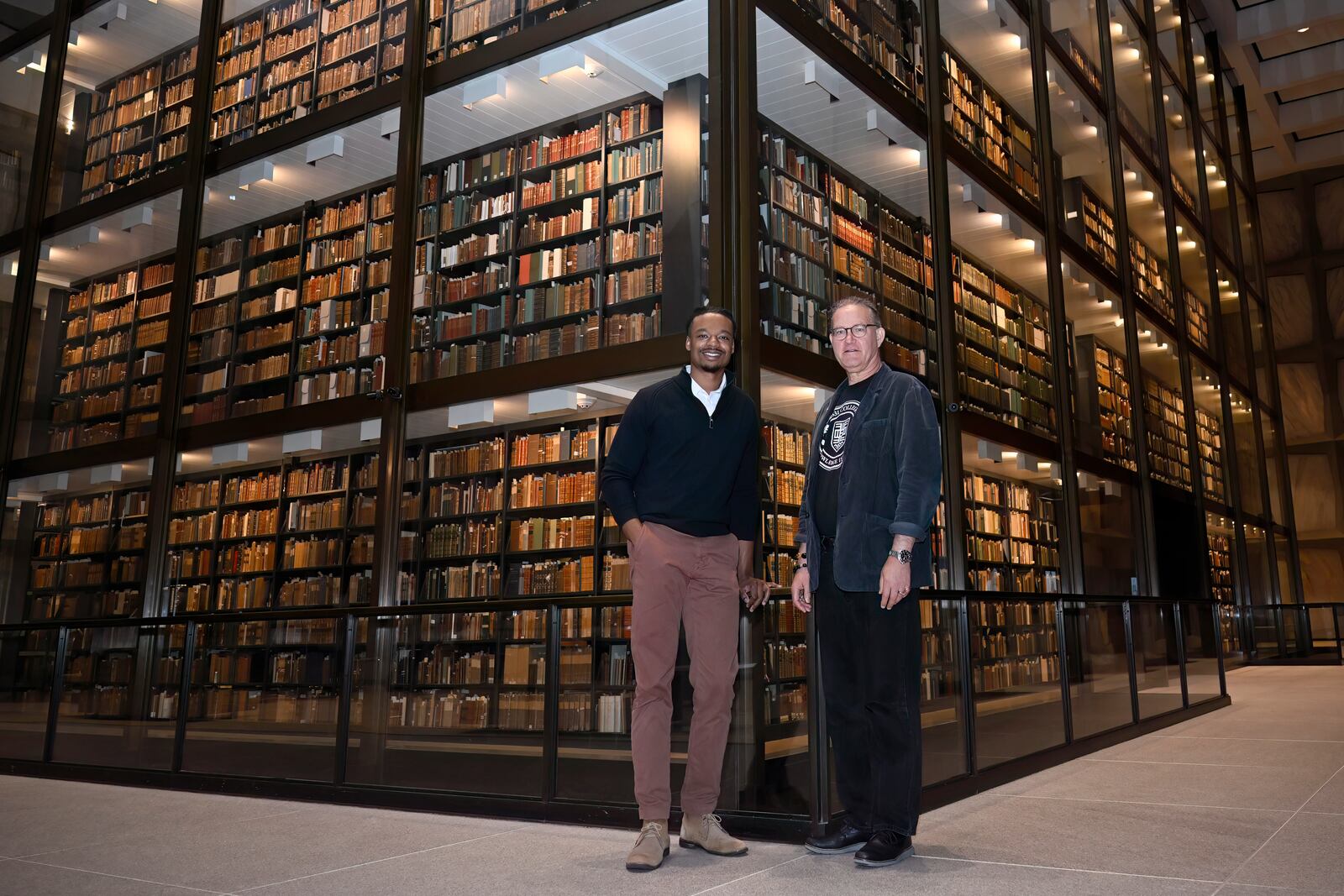 Tubyez Cropper, left, and Michael Morand, pose inside Yale's Beinecke Rare Book & Manuscript Library, Wednesday, Oct. 9, 2024, in New Haven, Conn. In 1831, a coalition of Black leaders and white abolitionists proposed the nation's first African American college in New Haven. White male landowners with the sole authority to vote, many with ties to Yale College — rejected the plans on a vote of 700-4. Morand and Cropper released a short video documentary about it. (AP Photo/Jessica Hill)