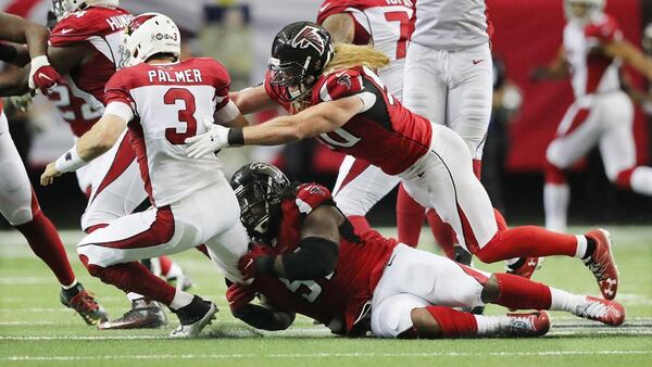 Falcons Courtney Upshaw and Brooks Reed sack Cardinals quarterback Carson Palmer for a loss during the third quarter Sunday, Nov. 27, 2016, in Atlanta. (Curtis Compton/ccompton@ajc.com)