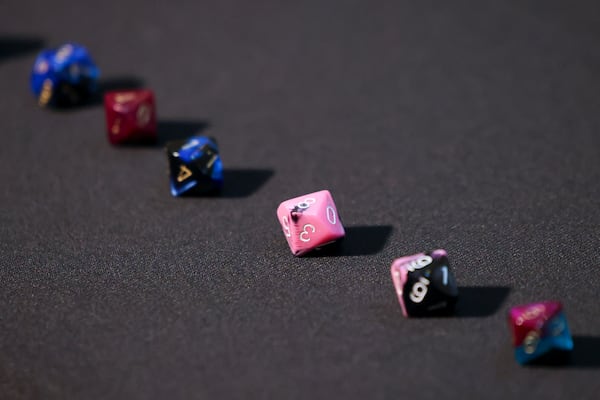 Ten-sided dice were used to create a random 20-digit number as part of the random selection of ballots to be audited for the presidential election. (Jason Getz/AJC)