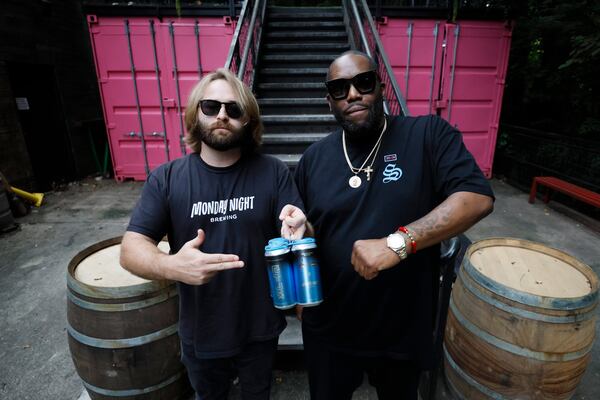 Peter Kiley, brewmaster at Monday Night Brewery, and rapper Killer Mike, pose with the beer created in partnership to benefit the nonprofit organization Pawkids Community Outreach. Wednesday, Sept. 20, 2023.
Miguel Martinez /miguel.martinezjimenez@ajc.com