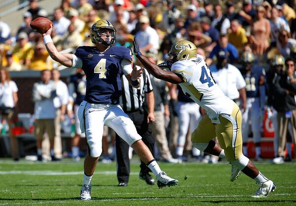 ATLANTA, GA - OCTOBER 17: Nathan Peterman #4 of the Pittsburgh Panthers is pressured by KeShun Freeman #42 of the Georgia Tech Yellow Jackets at Bobby Dodd Stadium on October 17, 2015 in Atlanta, Georgia. (Photo by Kevin C. Cox/Getty Images)