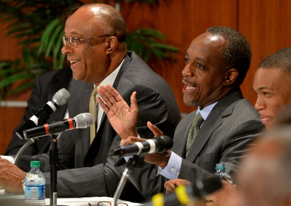 JANUARY 21, 2014 STONE MOUNTAIN Superintendent Michael Thurmond applauds as the board gets the word the district is off probation. The Southern Association of Colleges and Schools has cleared the DeKalb school district from its probationary status saying the threat to its accreditation is no longer eminent. Dr Mark Elgart, CEO of AdvancED made the presentation before the Dekalb County School Board and a standing room only crowd Tuesday, January 21, 2014. However, Elgart, the SACS chief, says the district is still under watch and they are now under something called accreditation warning. Gov. Nathan Deal was also there to applaud the school district on its progress. Deal removed six board members last year after the district was placed on probation for mismanagement. 'KENT D. JOHNSON/KDJOHNSON@AJC.COM Michael Thurmond is proposing raises for all district employees. KENT D. JOHNSON/KDJOHNSON@AJC.COM