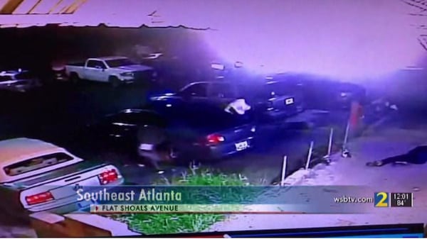 Surveillance footage shows several people diving behind parked cars during a drive-by shooting last Wednesday in East Atlanta Village. 