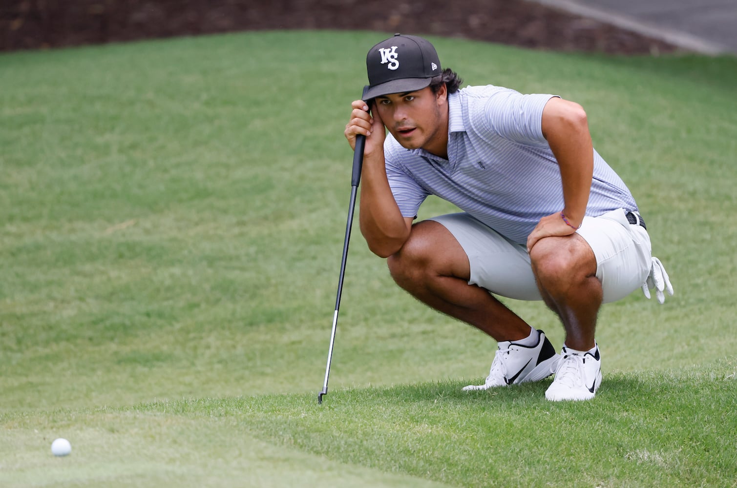 Scotty Kennon, Wake Forest University, who finished second, lines up his putt on the seventh green during the final round of the Dogwood Invitational Golf Tournament in Atlanta on Saturday, June 11, 2022.   (Bob Andres for the Atlanta Journal Constitution)