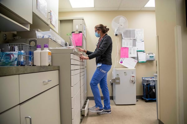 12/03/2020 —  Carrollton, Georgia —  A Tanner Health System Hospital nurse gathers medicine for patients in a medicine room on the COVID-19 isolation floor at Tanner Health System Hospital in Carrollton Thursday, December 3, 2020.  (Alyssa Pointer / Alyssa.Pointer@ajc.com)