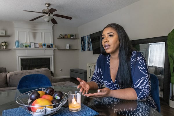 Alexa McDonald talks about her homeowner association fees in her Duluth home Friday, July 8, 2022.  Steve Schaefer / steve.schaefer@ajc.com)