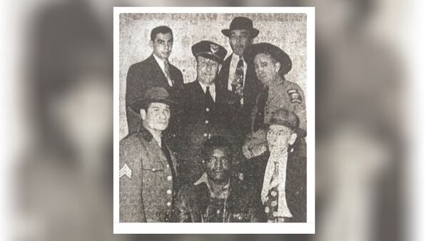 Carrollton sharecropper Clarence Henderson is photographed moments before his first trial on Jan. 30, 1950, while ringed by state and local law enforcement. The one-day trial was a spectacle and held under tight security with armed state troopers in the courtroom. Henderson would be convicted three times in separate trials which were all overturned. (File)