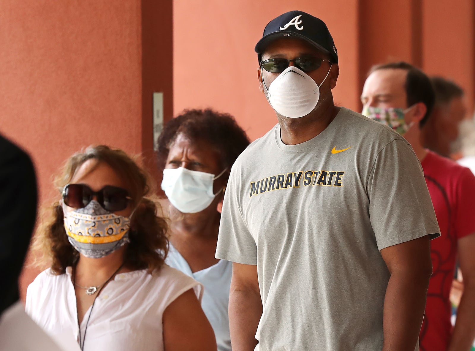 051820 Marietta: Voters wear masks while lining up to cast their votes during the first day of early voting at the Cobb County Board of Elections & Registration on Monday afternoon, May 18, 2020, in Marietta.   Curtis Compton ccompton@ajc.com