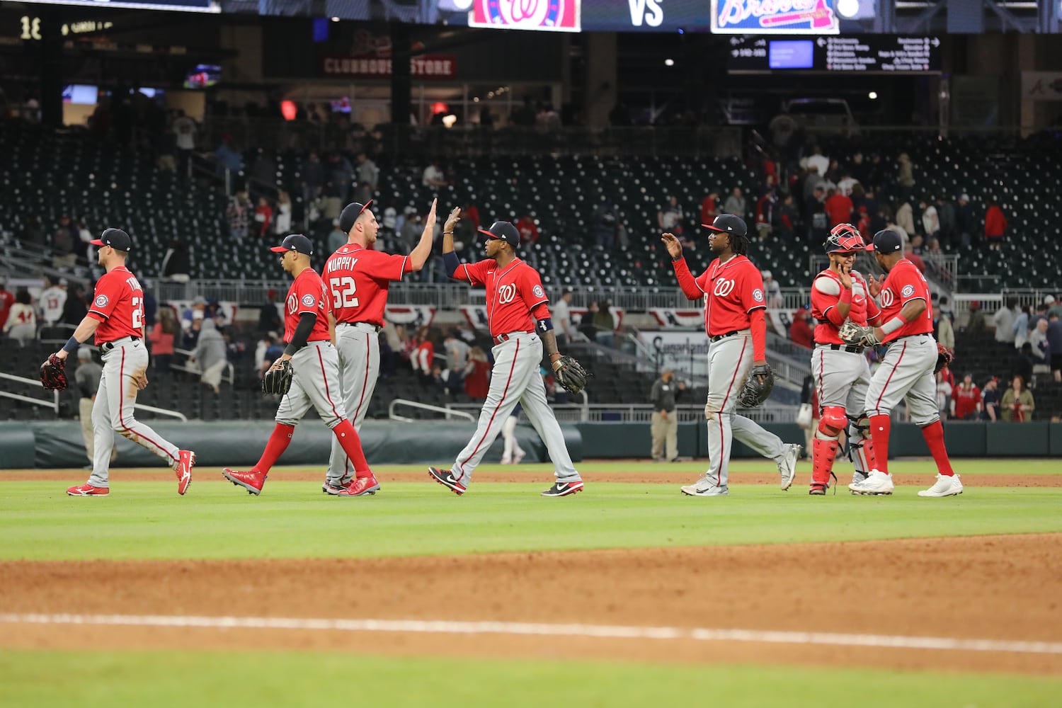 Nationals players celebrate after defeating the Braves 11-2 on night at Truist Park. (Miguel Martinez/miguel.martinezjimenez@ajc.com)