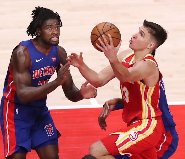 Hawks guard Bogdan Bogdanovic goes to the basket against Detroit's Isaiah Stewart Monday, Dec. 28, 2020, in Atlanta. (Curtis Compton / Curtis.Compton@ajc.com)