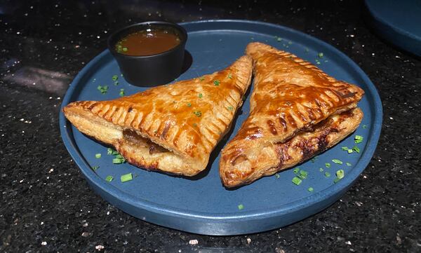 The French onion hand pies at Humble Pie pack all the flavor of French onion soup into a savory pastry. Ligaya Figueras/ligaya.figueras@ajc.com  