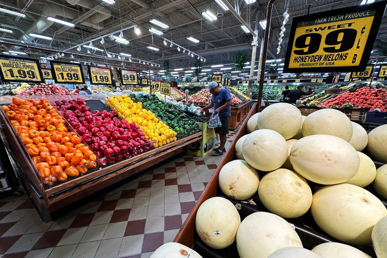 Customers shop at a grocery store in Waukegan, Ill., Friday, Sept. 20, 2024. (AP Photo/Nam Y. Huh)